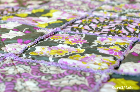 The Rural*ish "Sienna" rag quilt is perfect for baby girls! Vintagey roses, groovy butterflies, delicate flowers, and leafy feathers come together beautifully in a modern palette of violets and lavenders, pinks, charcoal gray, olive and lime greens. www.ruralish.etsy.com 